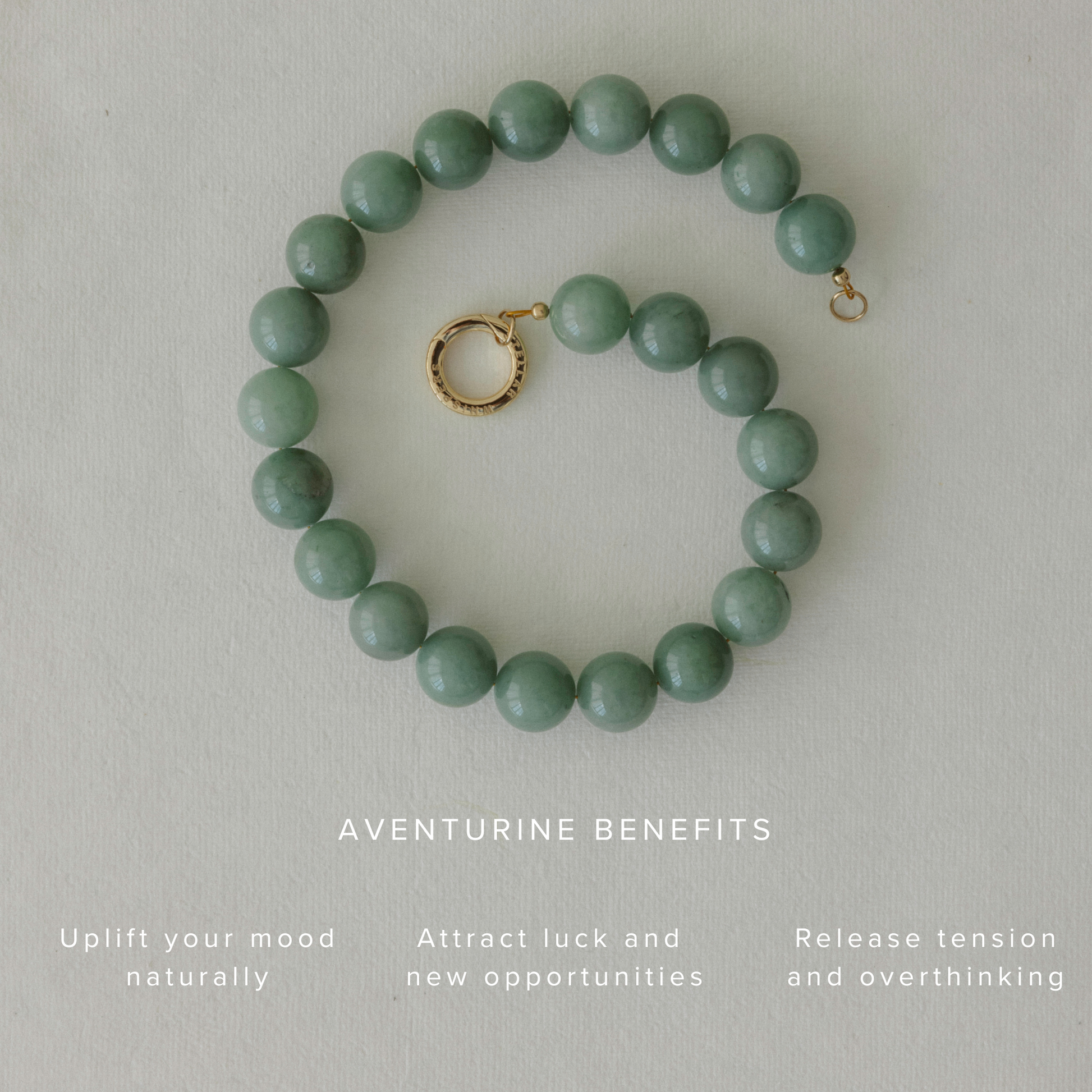 Green Aventurine beaded necklace styled in a spiral on a neutral background, featuring a brass clasp and text highlighting its emotional benefits: uplifting mood, attracting luck, and easing overthinking.